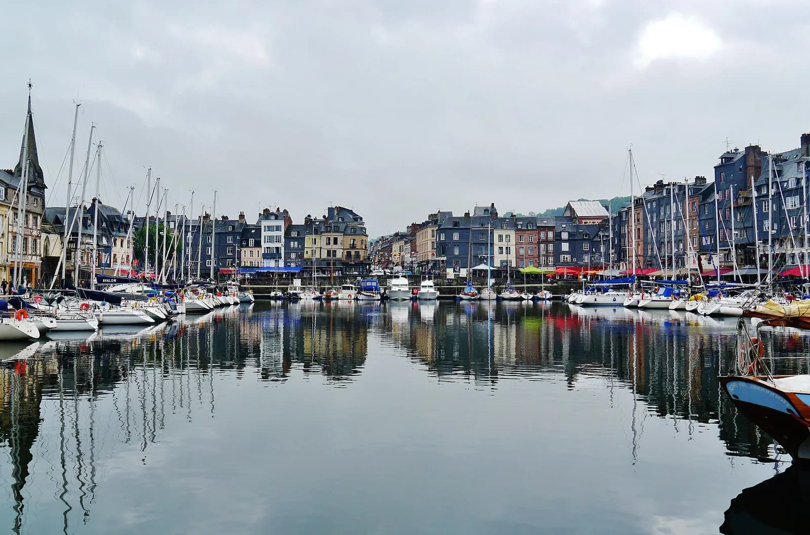 Boats and historic waterfront buildings around Honfleur’s Vieux Bassin