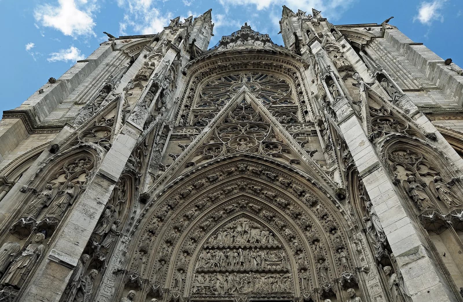 The carved Gothic façade of Rouen Cathedral viewed from below